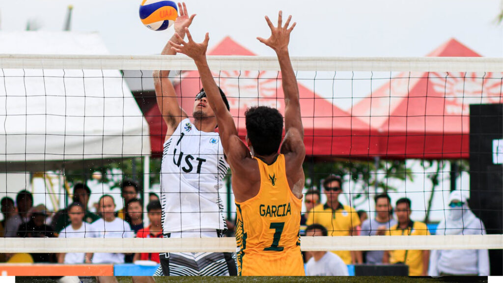 Two men are playing volly ball