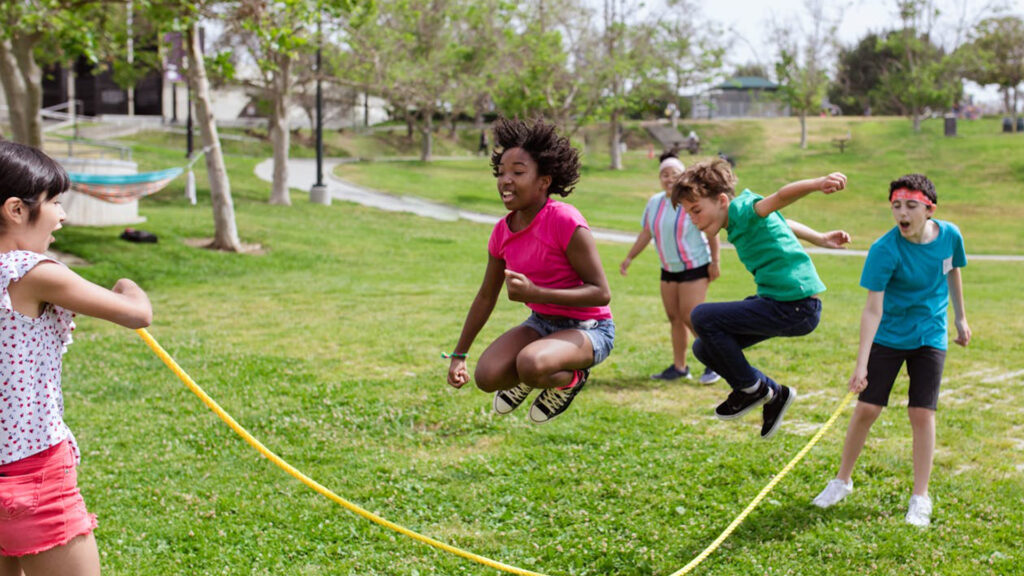 Childer cheerfully playing skipping ropes
